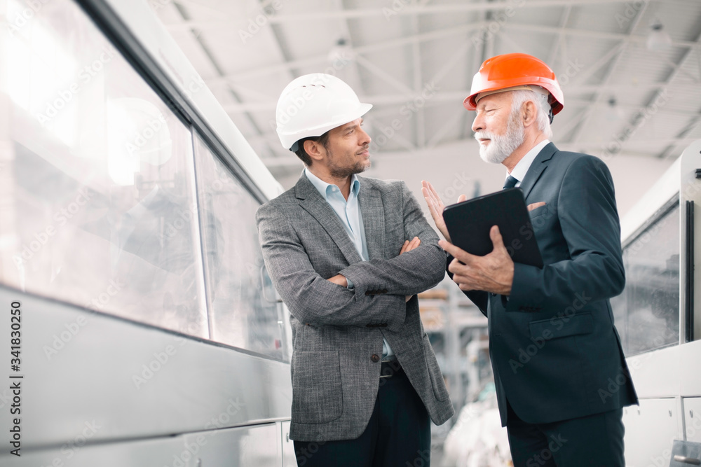 Colleagues working together. Arhitects in factory. Colleagues working together. Arhitects in factory.