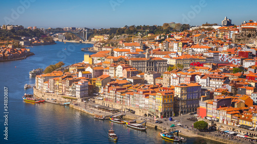Fototapeta Naklejka Na Ścianę i Meble -  Panoramic view of Old city of Porto (Oporto) and Ribeira over Douro river, Portugal. Concept of world travel, sightseeing and tourism.