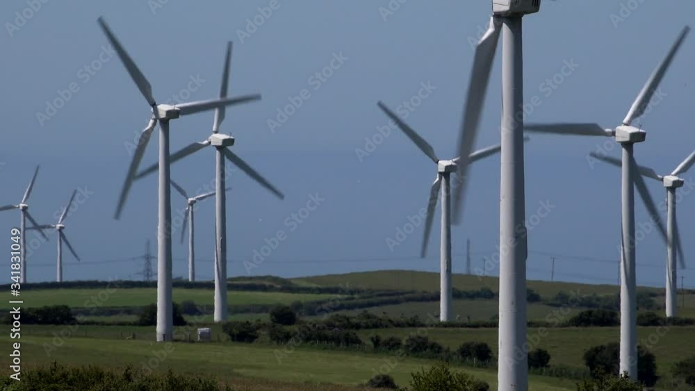 Wind turbines producing power in the UK landscape