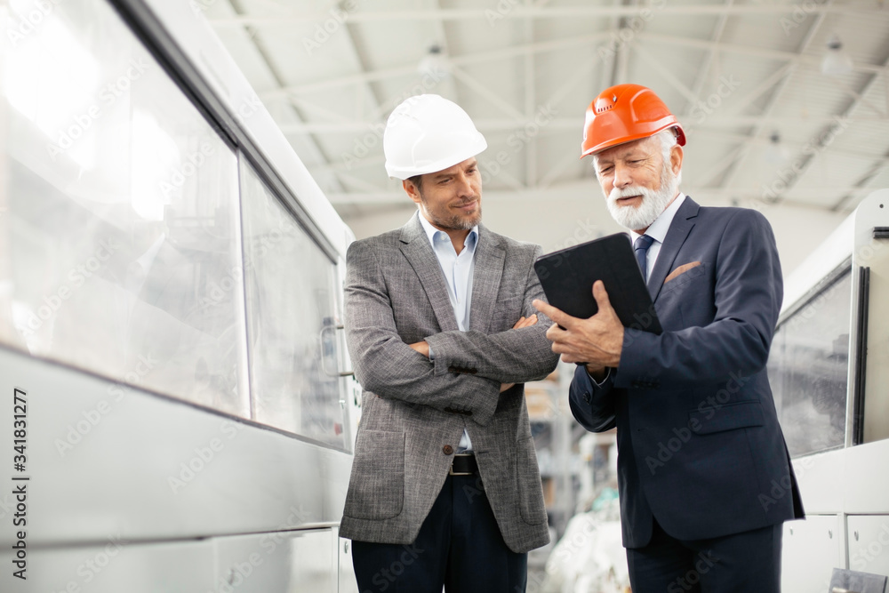 Colleagues working together. Arhitects in factory. Colleagues working together. Arhitects in factory.