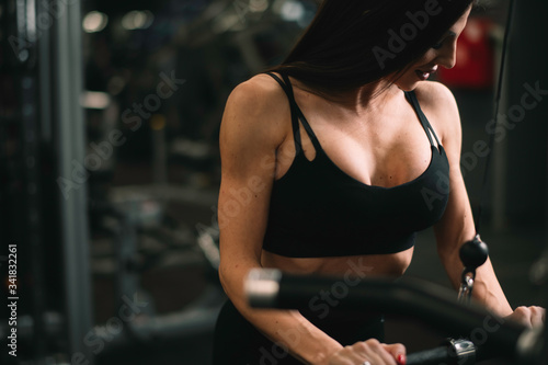 Fitness woman on training. Young woman in the gym.  © JustLife