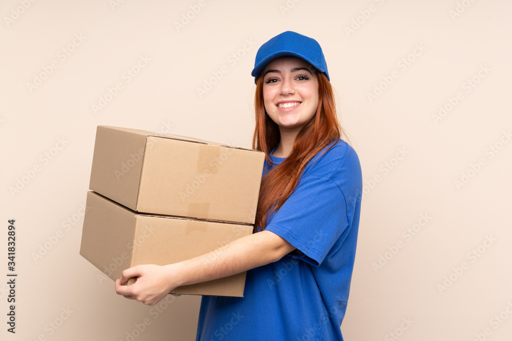 Young teenager delivery girl over isolated background looking to the side Young teenager delivery girl over isolated background looking to the side
