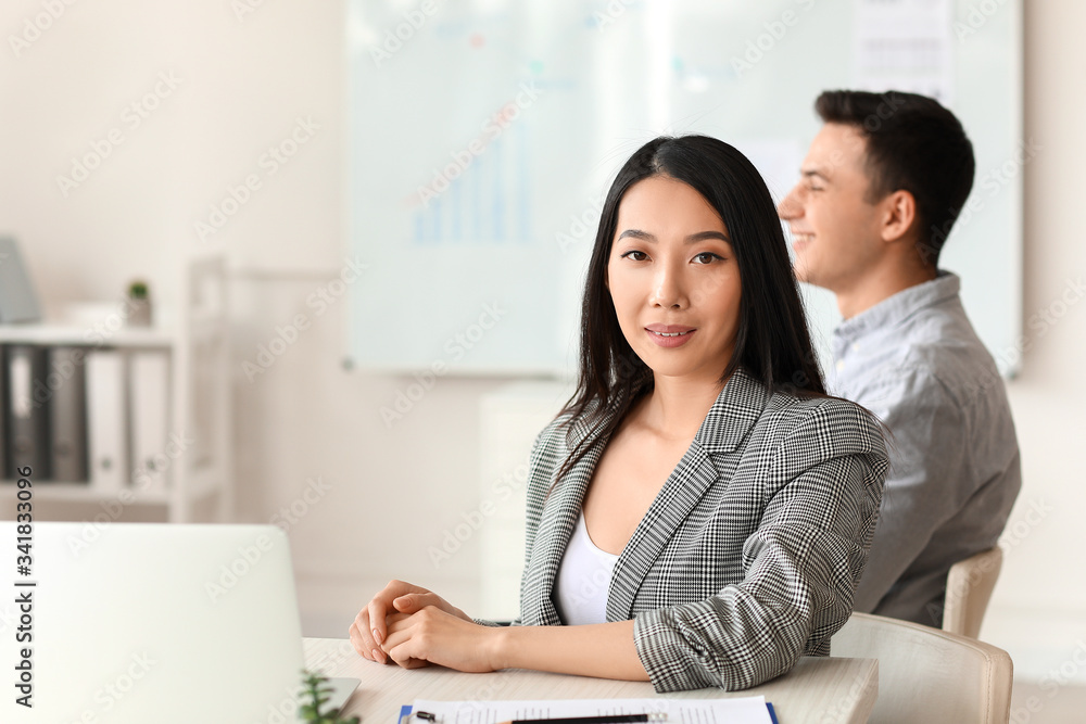 Asian businesswoman during meeting in office Asian businesswoman during meeting in office
