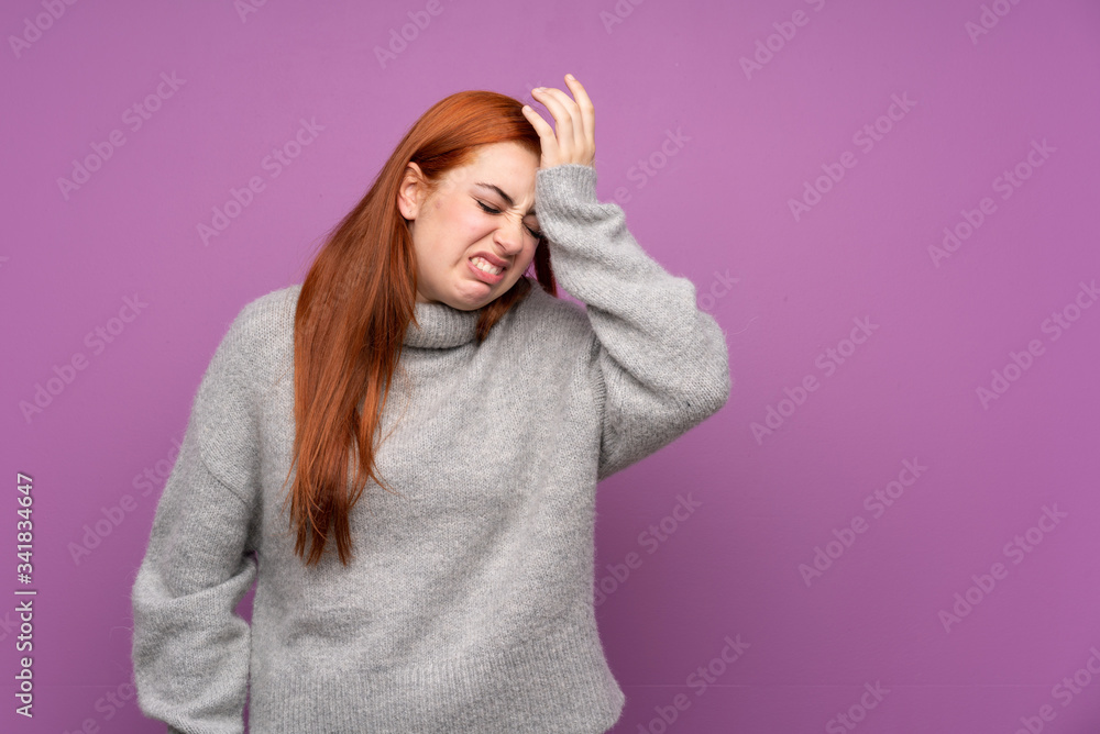 Redhead teenager girl over isolated purple background having doubts with confuse face expression Redhead teenager girl over isolated purple background having doubts with confuse face expression