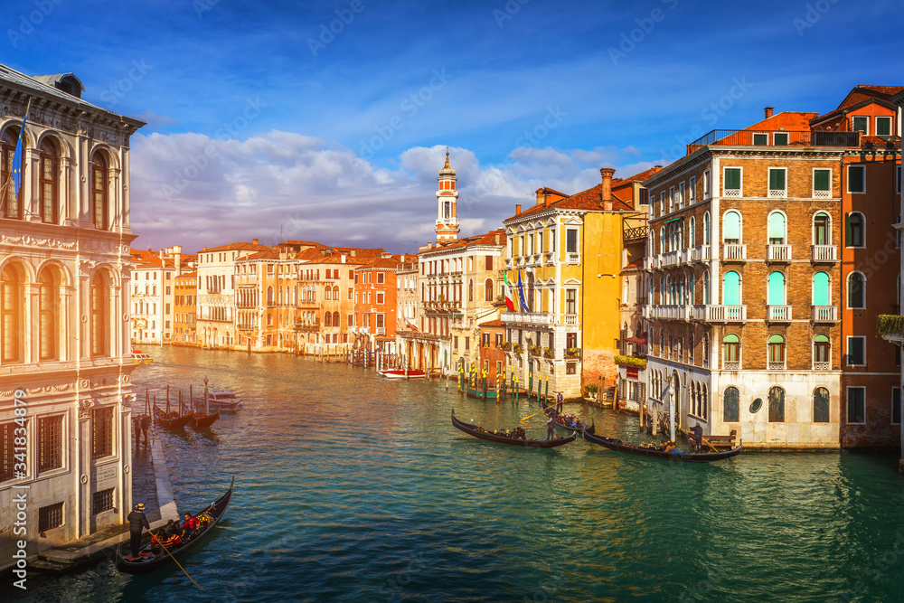 Canal with gondolas in Venice, Italy. Architecture and landmarks of Venice. Venice postcard with Venice gondolas.