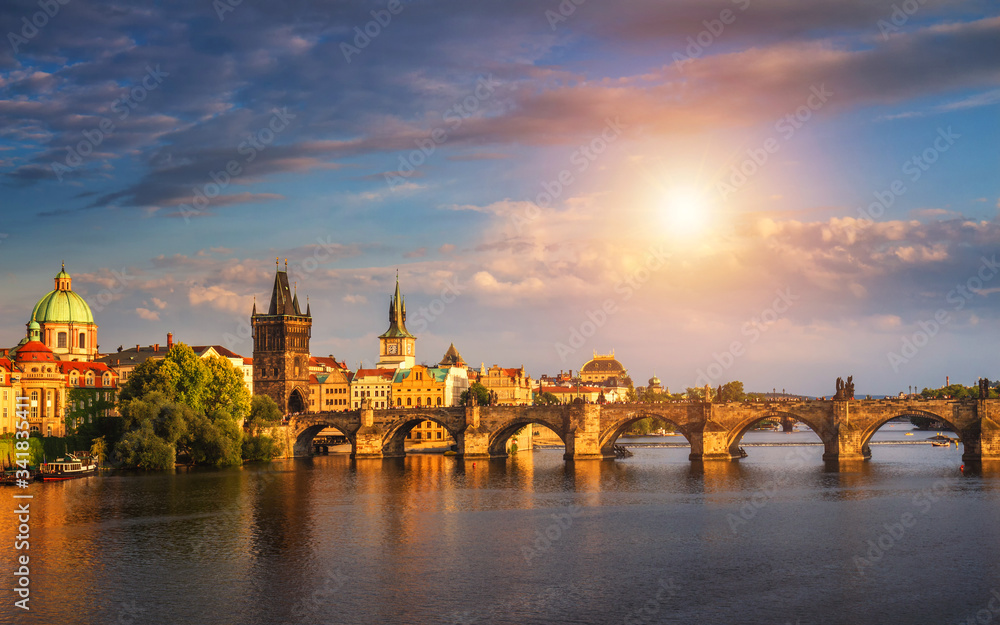 Prague, Czech Republic panorama with historic Charles Bridge and Vltava river on sunny day.