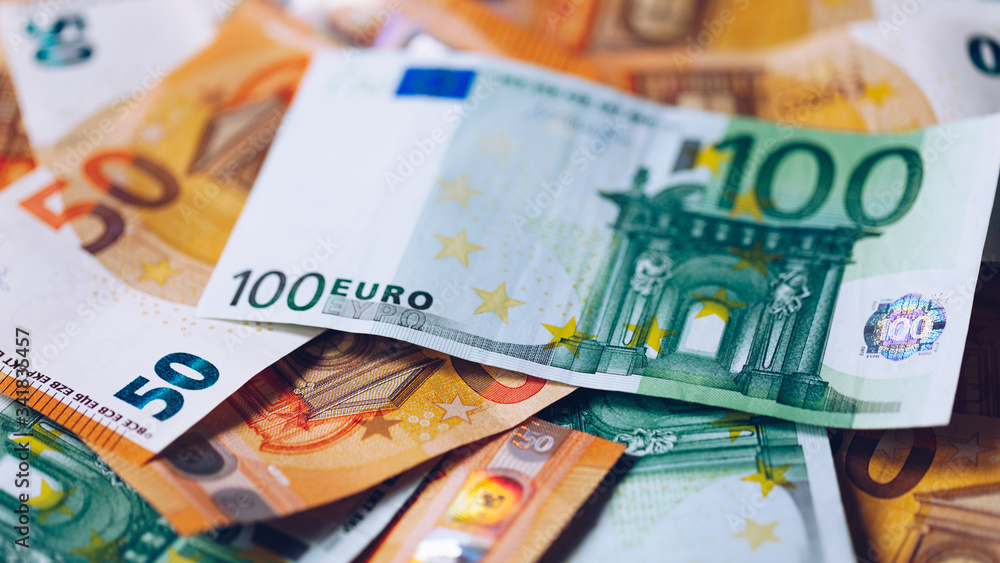 Obraz premium Euro money, Euro cash background. Banknotes of the european union. Euro cash. Many Euro banknotes of different values.