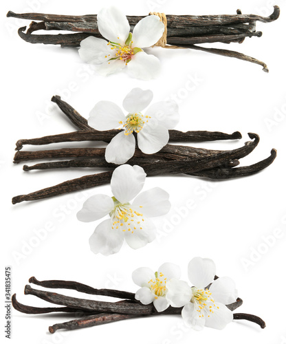 Set with aromatic vanilla pods and flowers on white background