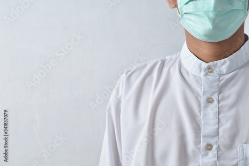 Doctor wearing protection face mask against coronavirus.
