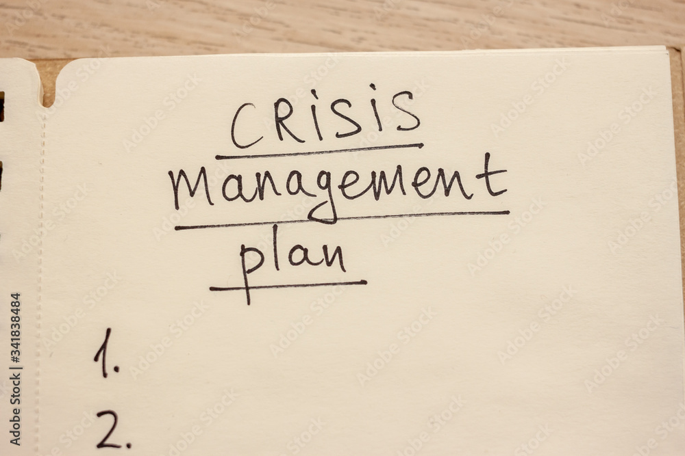 crisis management plan written words in notebook crisis management plan written words in notebook