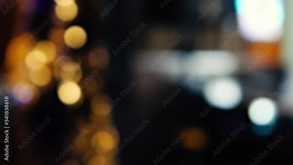 Blurred image of the interior of the restaurant. Defocused people with different activities. A glass of wine or cocktail with a slice of pineapple in the foreground. Blurred image of the interior of the restaurant. Defocused people with different activities. A glass of wine or cocktail with a slice of pineapple in the foreground.