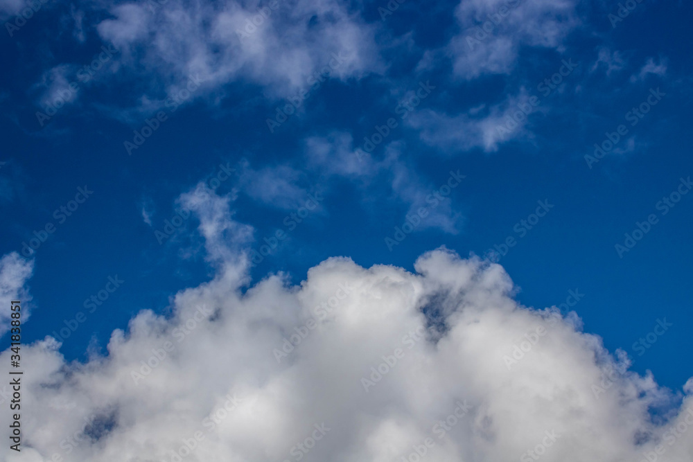 Obraz premium Beautiful blue sky with white clouds. Spring weather