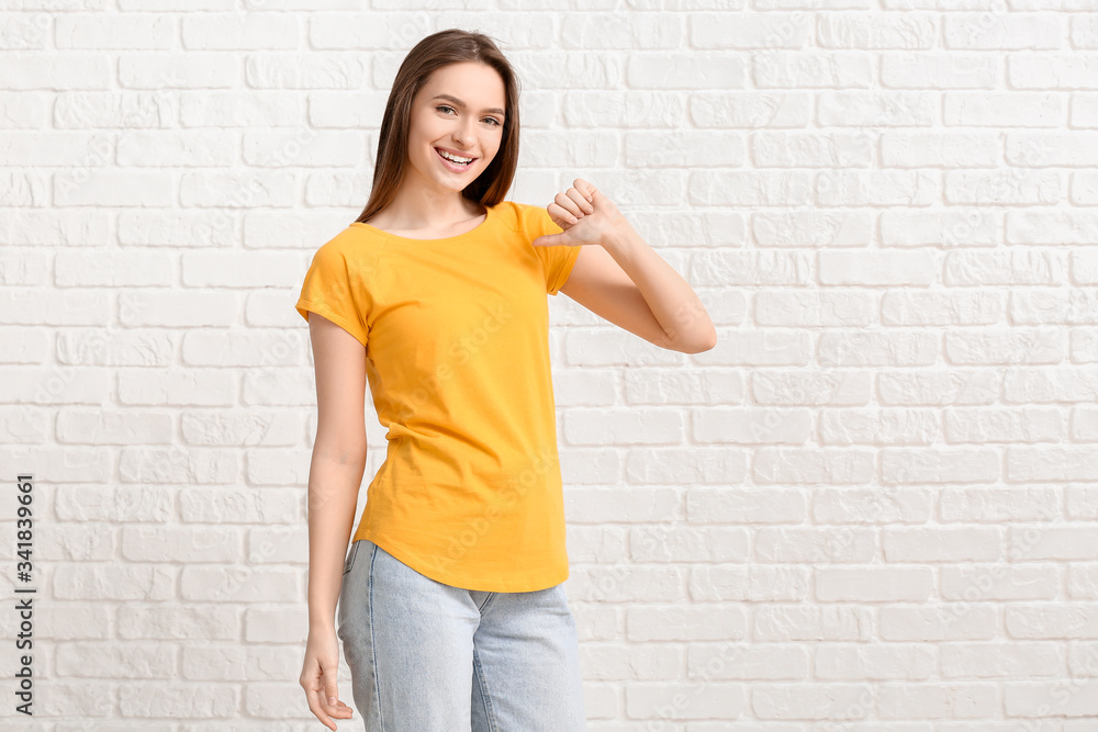 Young woman in stylish t-shirt on white background Young woman in stylish t-shirt on white background