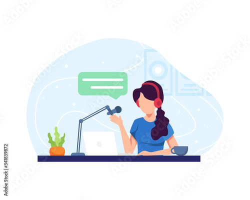 Female podcaster talking to microphone
