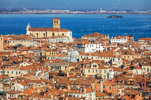 Venice panoramic aerial view with red roofs, Veneto, Italy. Aerial view with dense medieval red roofs of Venice, Italy © daliu