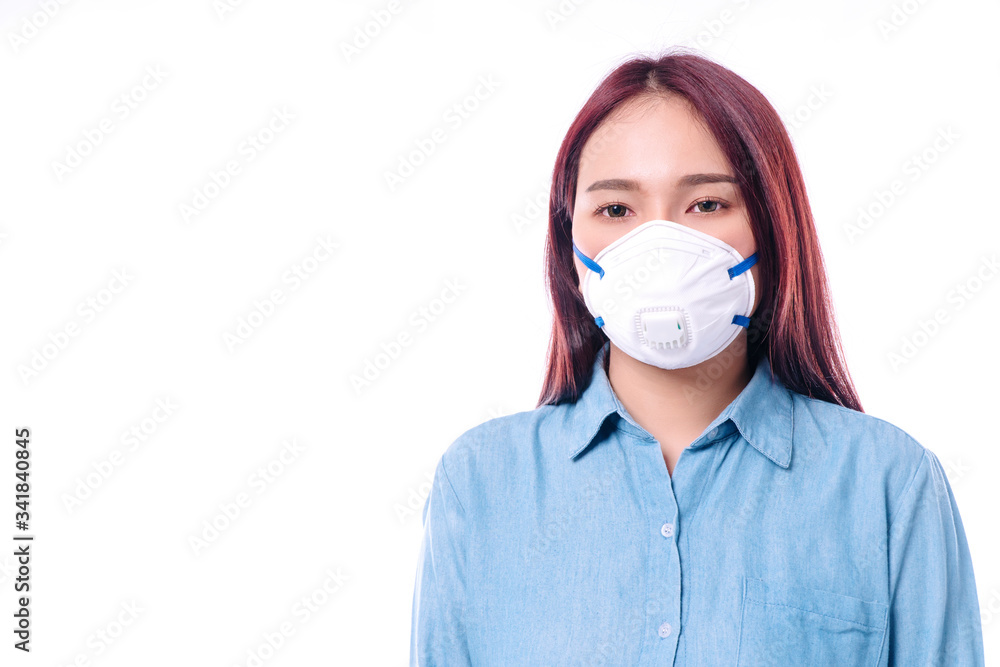 Young women wear face masks to protect disease viruses covid19 and air pollution (PM2.5) or N95 mask safe her healthy problem on isolated white background. Coronavirus and environmental pm2.5 concept. Young women wear face masks to protect disease viruses covid19 and air pollution (PM2.5) or N95 mask safe her healthy problem on isolated white background. Coronavirus and environmental pm2.5 concept.