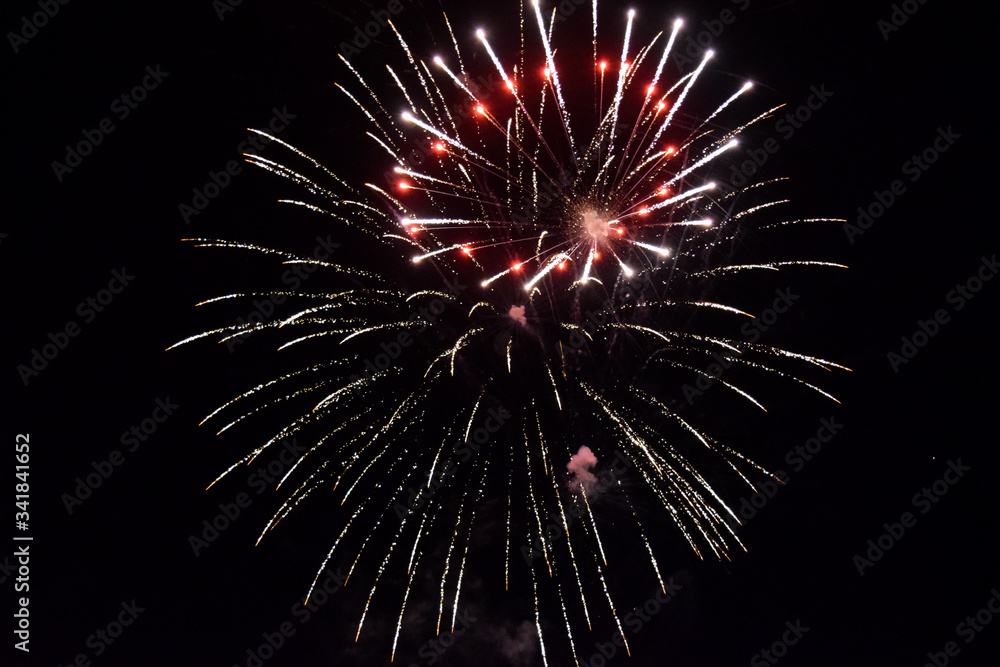 Festive salute in night sky. Explosions of fireworks and pyrotechnics in the sky. Festive salute in night sky. Explosions of fireworks and pyrotechnics in the sky.