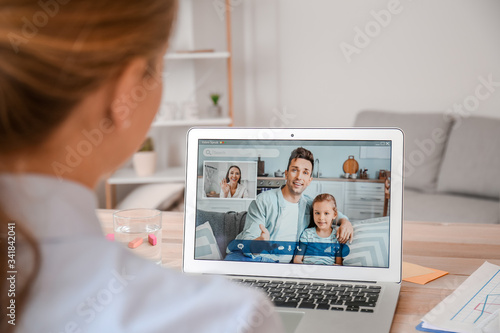 Young woman video chatting ...