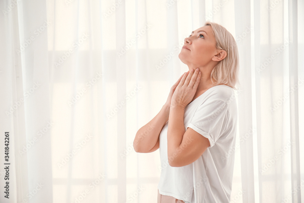 Woman with thyroid gland problem at home Woman with thyroid gland problem at home