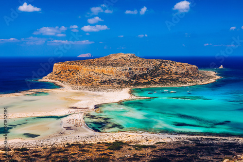 Fantastic panorama of Balos Lagoon and Gramvousa island on Crete, Greece. Cap tigani in the center. Balos beach on Crete island, Greece. Tourists relax and bath in crystal clear water of Balos beach. photo