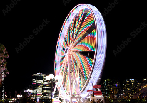 Long exposure photo of a Ferris wheel at night, Darling Harbour, Sydney Australia