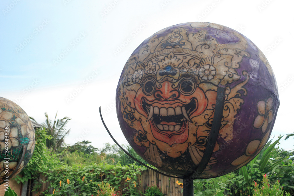 A decorative Balinese balloon with a painted dragon