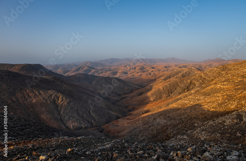 Panoramic view at volcanic landscape nearby Pajara on canary island Fuerteventura. Sunset in october 2019