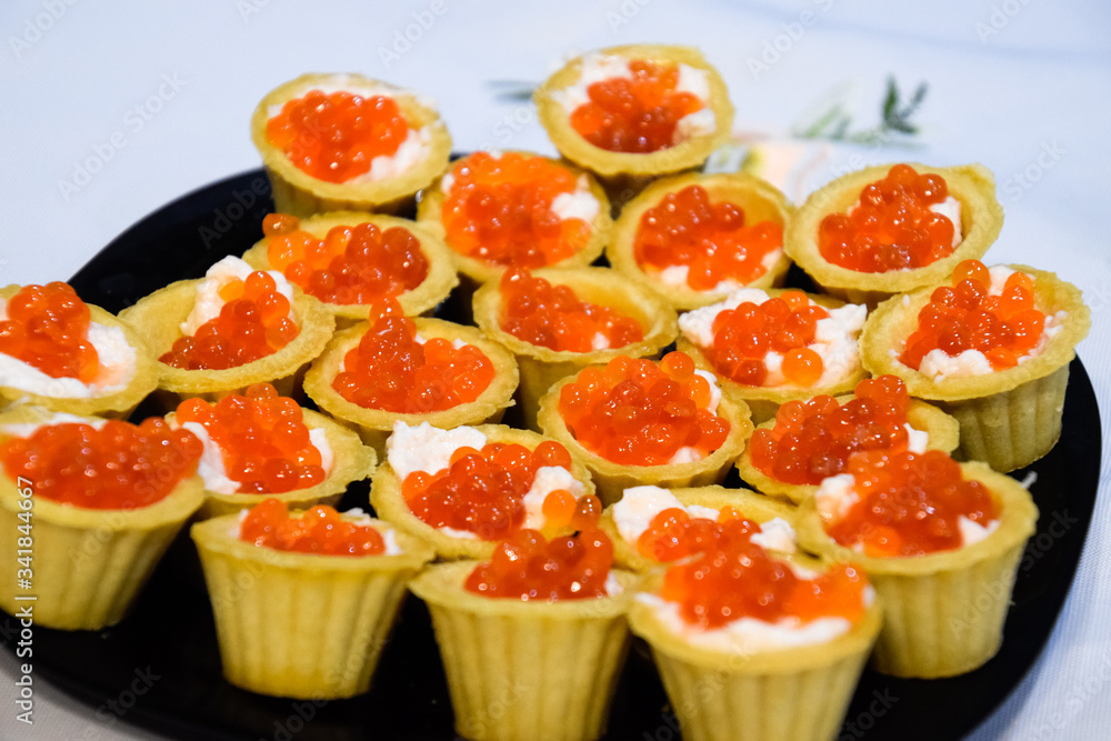 Waffle cups with mayonnaise and red caviar. Waffle cups with mayonnaise and red caviar.