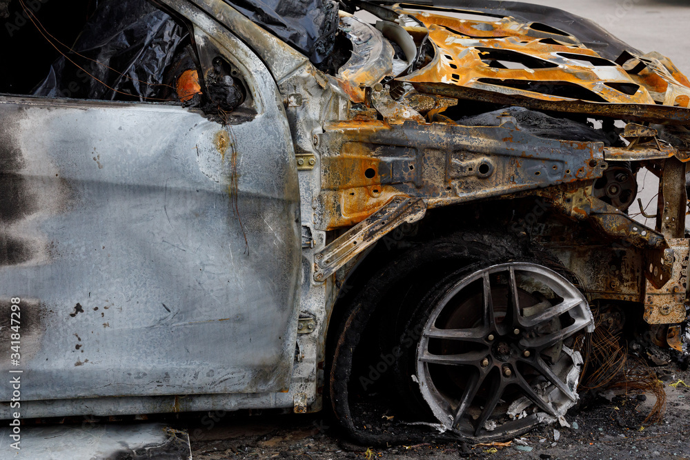 Part of the car after arson in a parking lot near the house. to illustrate an article about fire, banditry, an insured event, loss compensation.