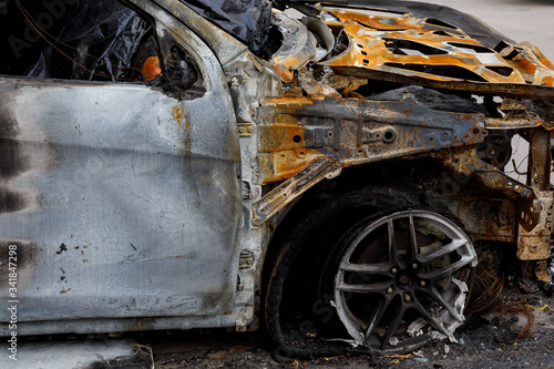 Part of the car after arson in a parking lot near the house. to illustrate an article about fire, banditry, an insured event, loss compensation.
