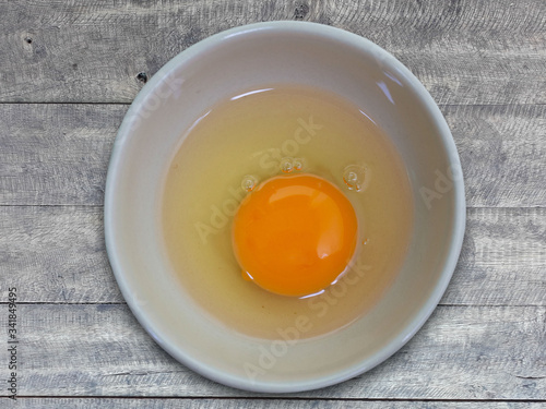 egg yolk on a wooden floor. (This has clipping path)