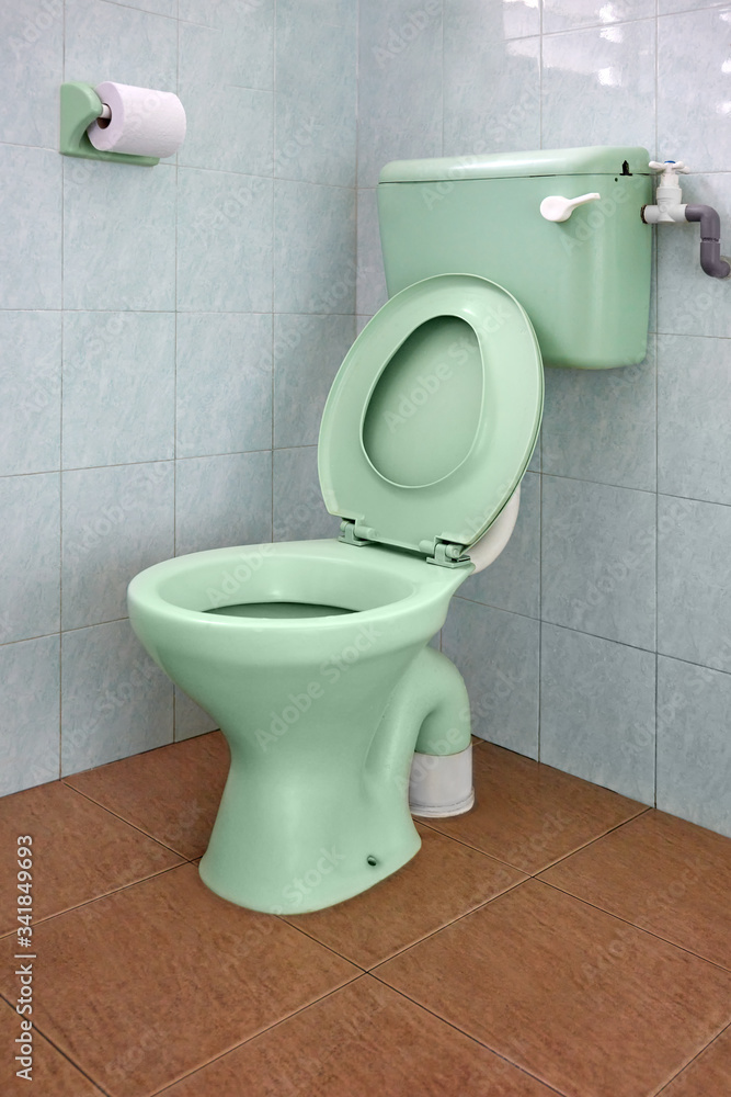 New ceramic toilet bowl in washroom. New ceramic toilet bowl in washroom.