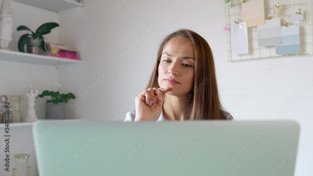 Young woman working on a laptop, writing notes. Medium shot on 4K. Young woman working on a laptop, writing notes. Medium shot on 4K.