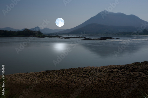 Beautiful full moon and reflection in the river © athapet