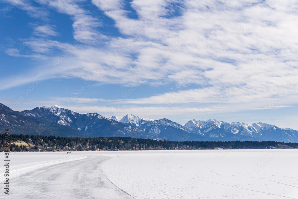 frozen Windermere lake and rocky mountains in british columbia canada.