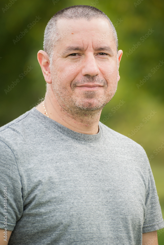 Portrait of a middle aged man with short hair, outdoor Portrait of a middle aged man with short hair, outdoor