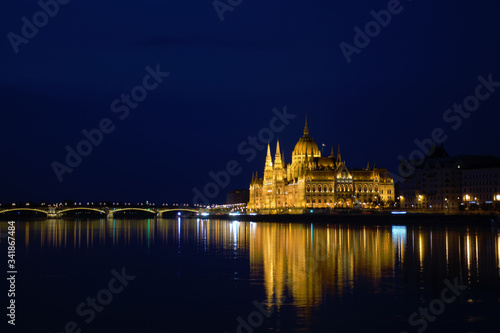 Parliament Palace and the bridge over the Danube in Budapest at night