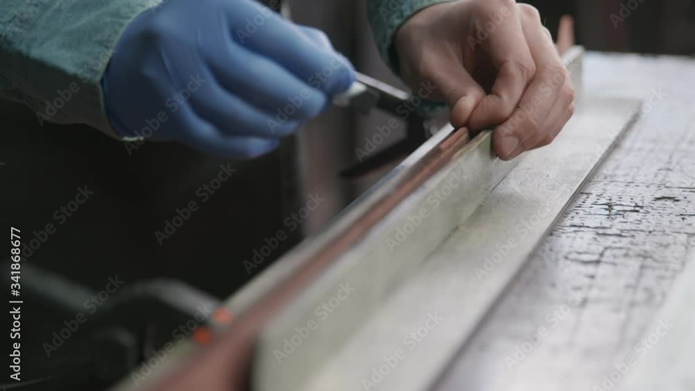 Applying Black Edge Dye to Leather. Working process of the leather belt in the leather workshop. Applying Black Edge Dye to Leather. Working process of the leather belt in the leather workshop.