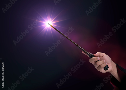 Magic wand on mysterious background, Miracle magical stick Wizard tool on black