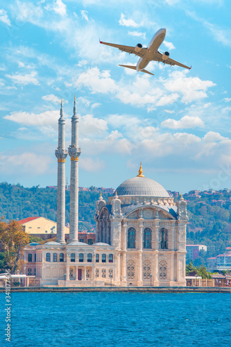 Canvas Print Airplane flying over Ortakoy Mosque  - Istanbul, Turkey