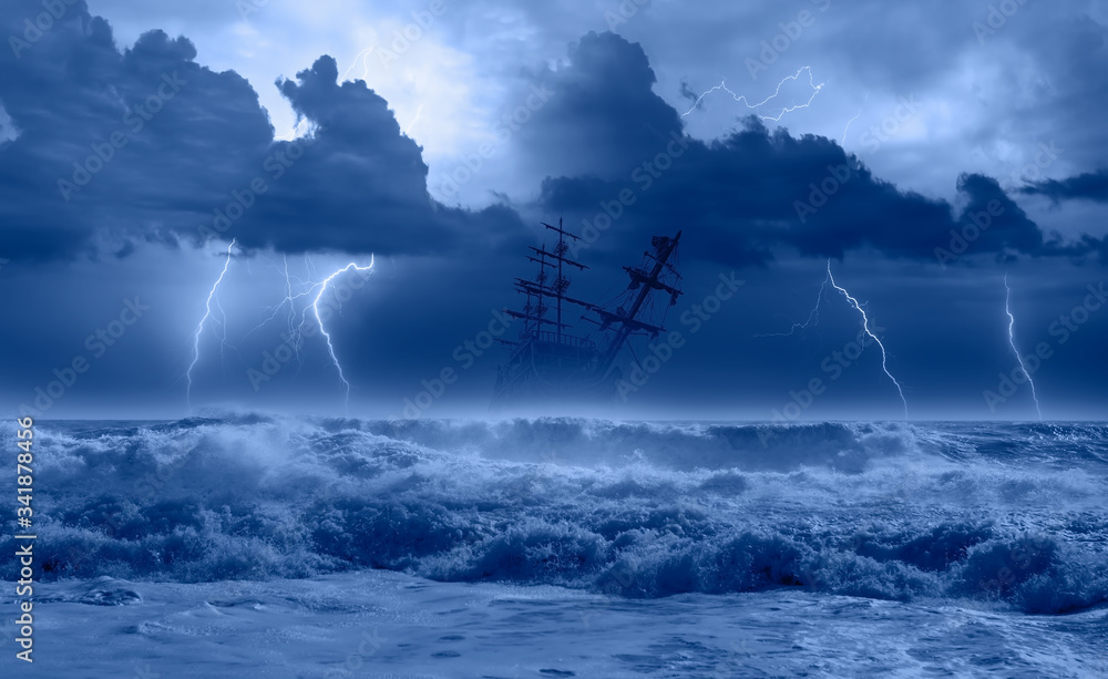 Silhouette of sailing old ship in storm sea on the background amazing ...