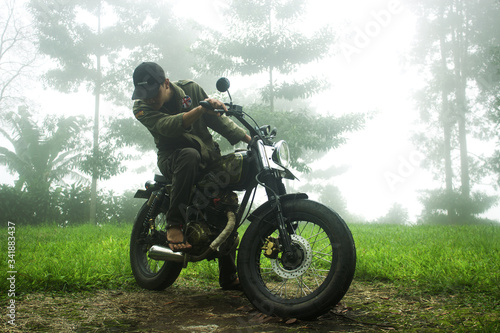 Fototapeta Naklejka Na Ścianę i Meble -  this photo shows the lifestyle of men who cannot be separated from the motorbike.
this photo was taken on March 10, 2020, around 3:30 p.m. in Pondok Halimun Sukabumi West Java Indonesia