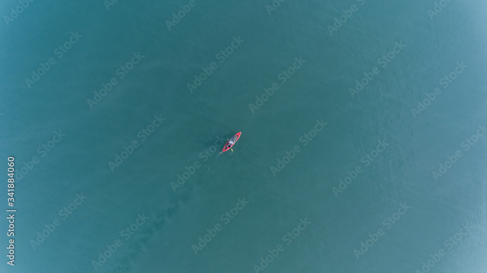 Aerial view of people with kayak over blue sea