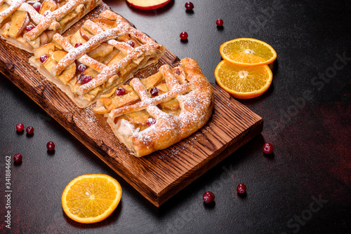 Delicious fresh pie baked with apple, pears and berries