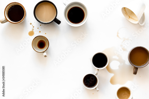 Many cups of coffee on white desk top view space for text