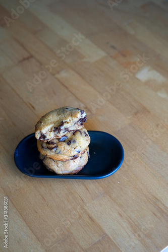 Soft and chewy chocolate chip cookies on a wooden table