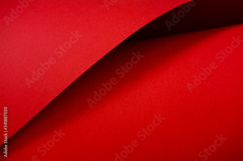 Designer red paper. Copy space on monochrome paper