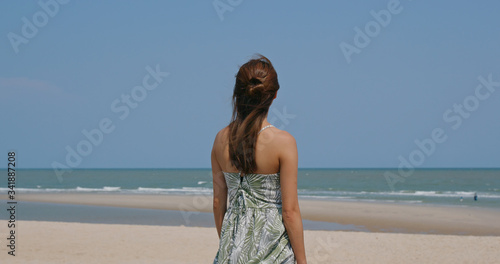 Beautiful woman on sandy beach