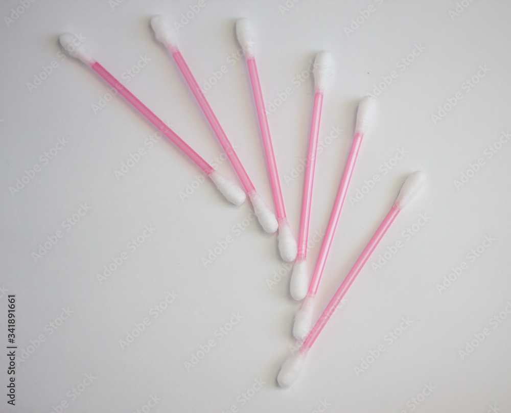 cotton buds, a set of cosmetic sticks on a white background cotton buds, a set of cosmetic sticks on a white background