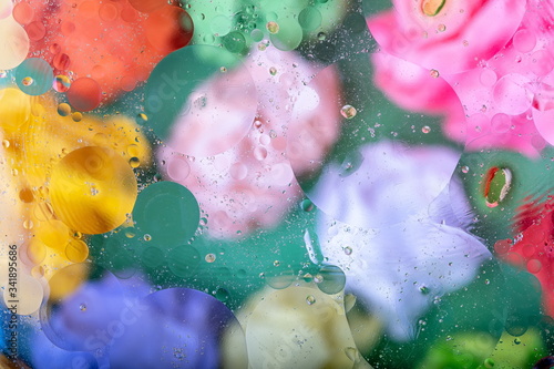 Modern abstract liquid background with water drops and colorful glass


